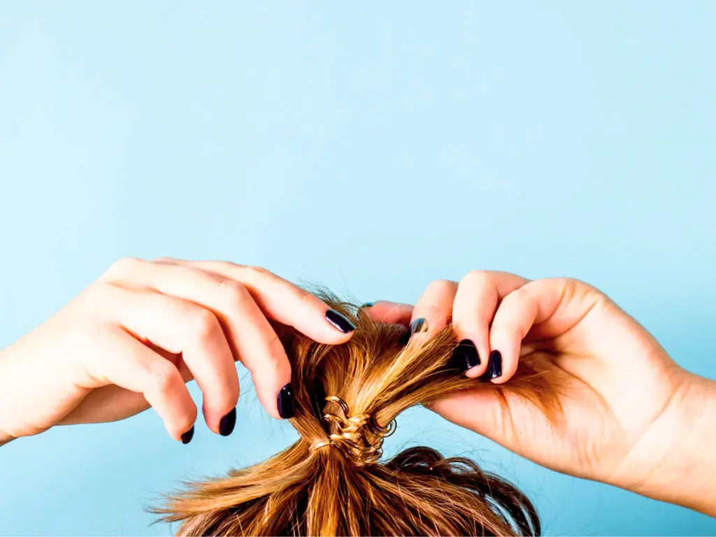 Is-the-Mom-Bun-contributing-to-my-postpartum-hair-loss Baby Blues