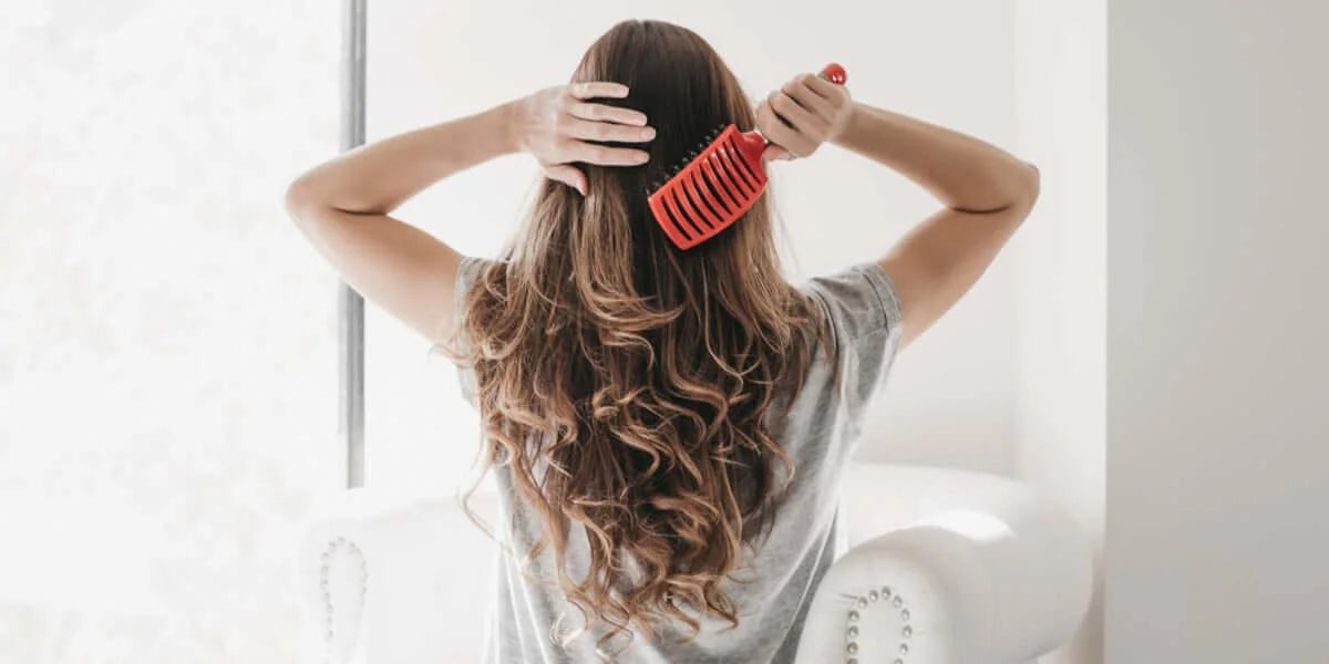 When should you brush your postpartum hair