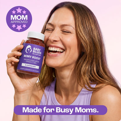 Mom holding Berry Boost elderberry gummies