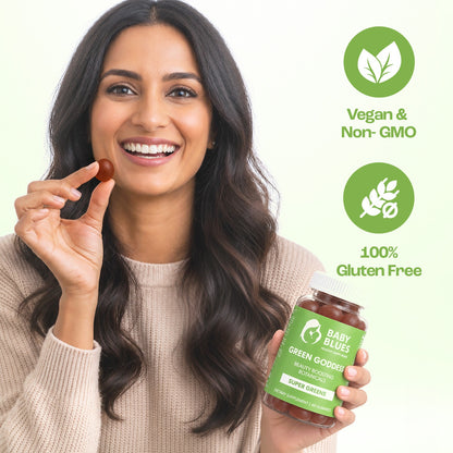 Smiling woman holding Green Goddess gummies, vegan, non-GMO and gluten free