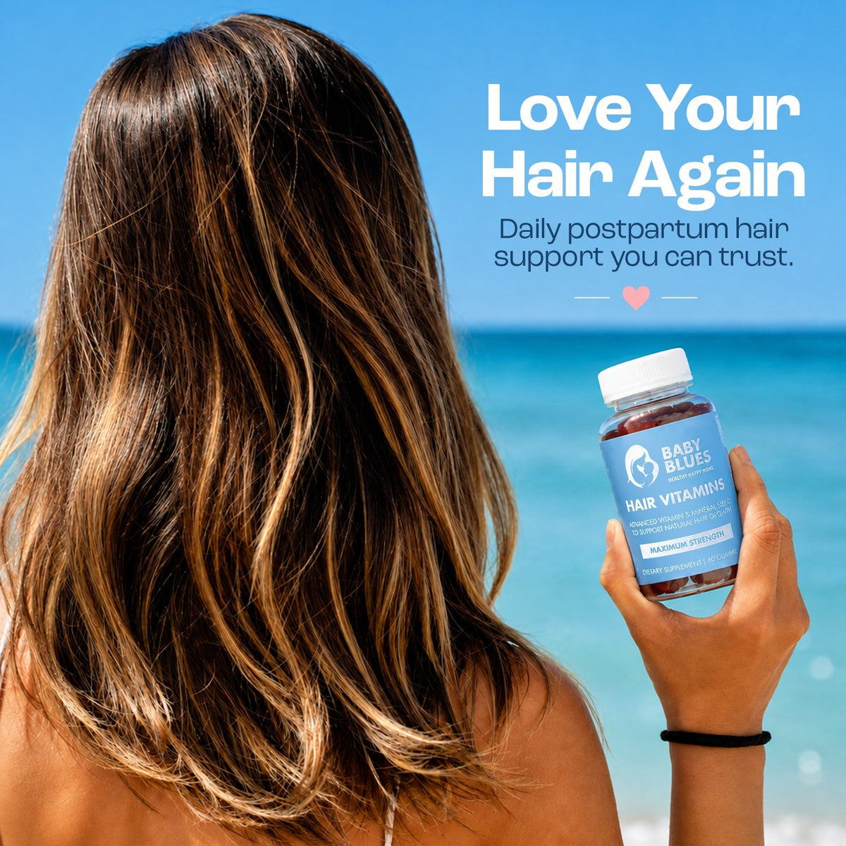 Woman at the beach holding Baby Blues Hair Vitamins